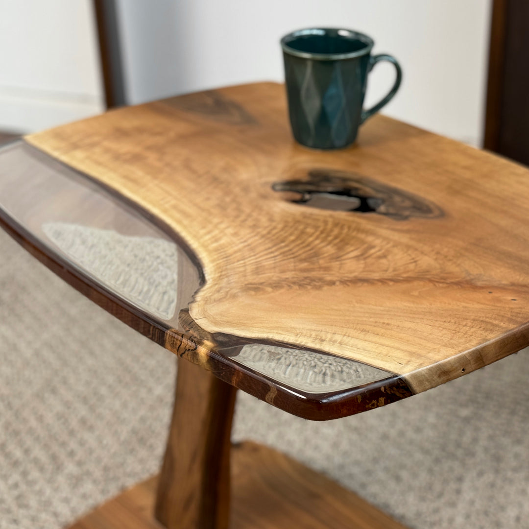 Clear epoxy accents on walnut wood side table
