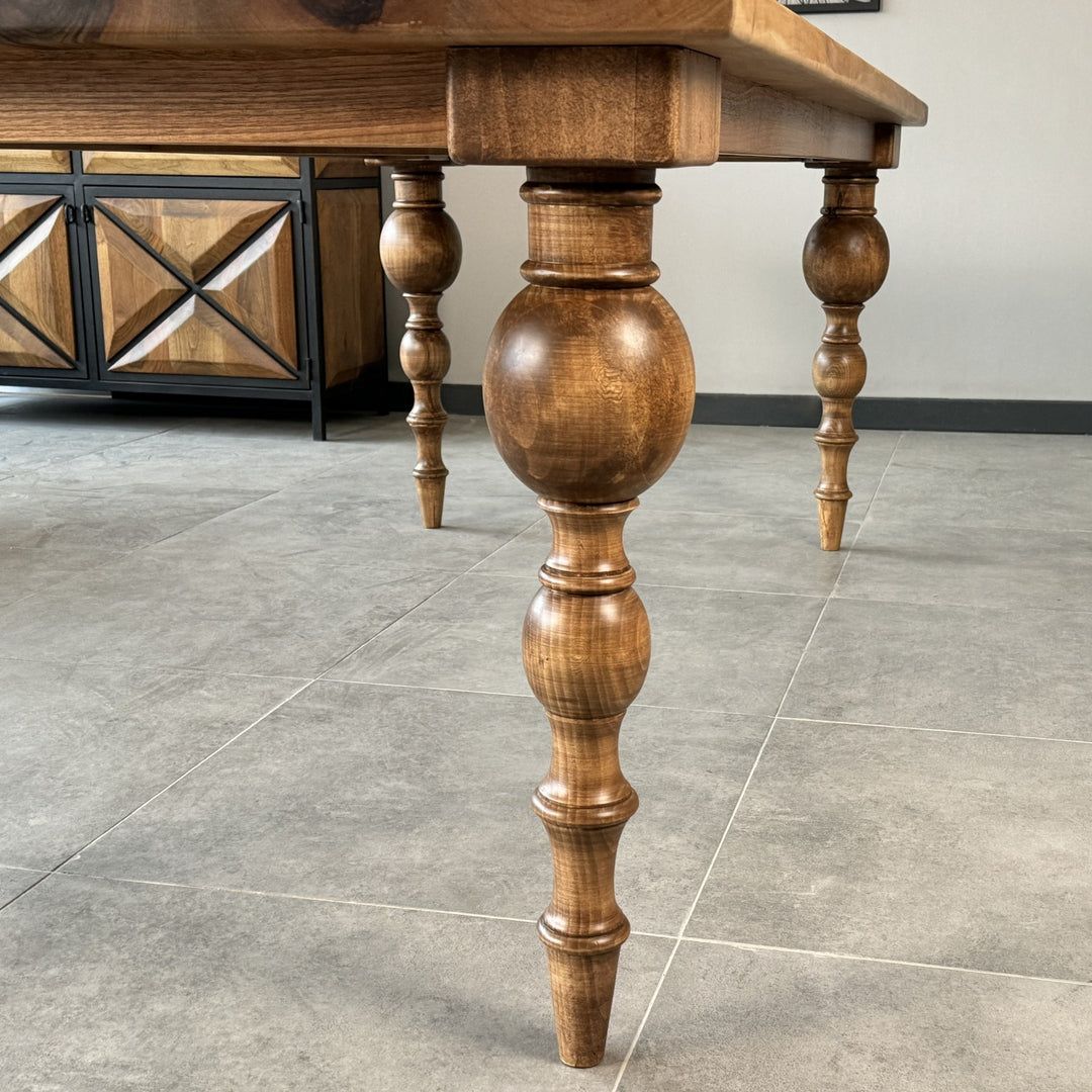 detailed-close-up-of-lathe-turned-legs-on-a-french-country-dining-table-crafted-from-walnut-wood-upphomestore