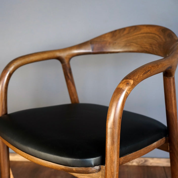 Walnut dining chair close up of handcrafted wooden joints and natural grain