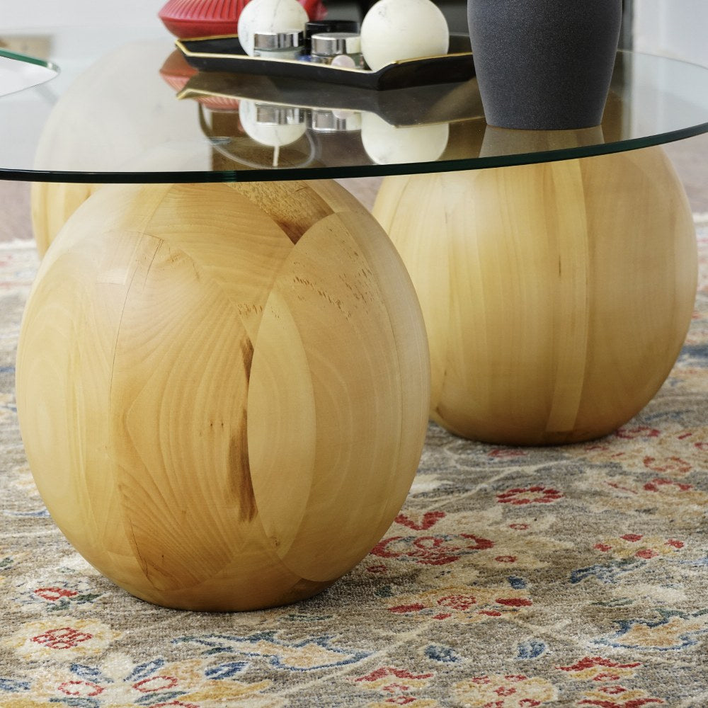 Close-up of a wooden ball leg supporting the tempered glass top of the coffee table