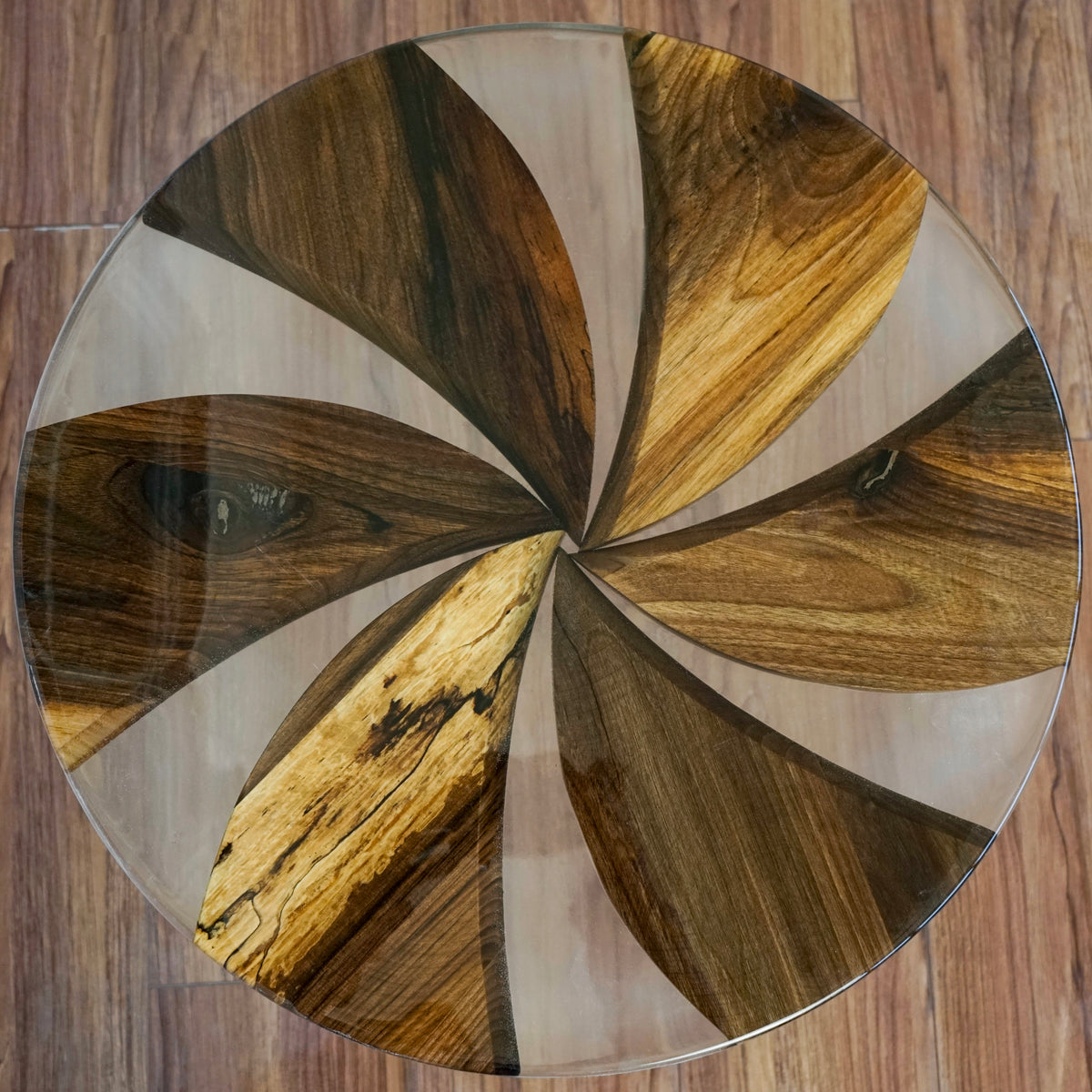 Top view of the windmill pattern, walnut wedges separated by clear epoxy