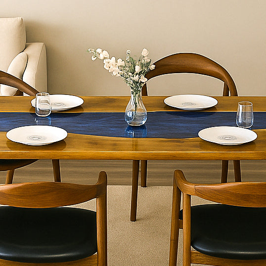 Farmhouse dining table with flowing blue river epoxy design in walnut wood