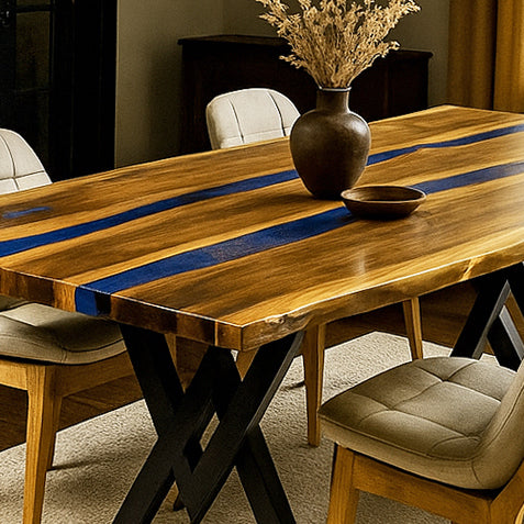 Wooden dining table with blue resin inlay and chairs in a room setting