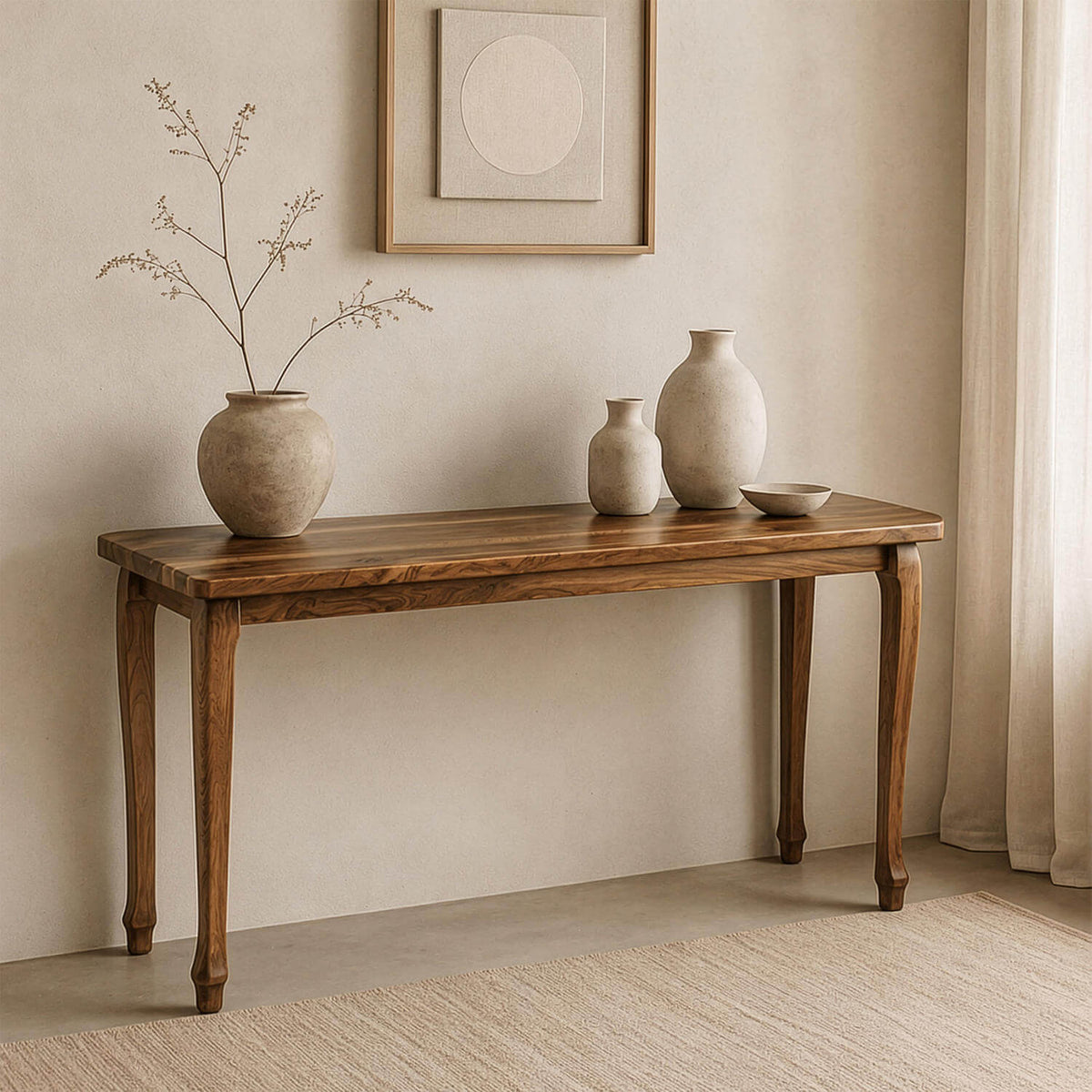 Walnut console table with cabriole legs from a slightly raised front view, with vases and a framed print