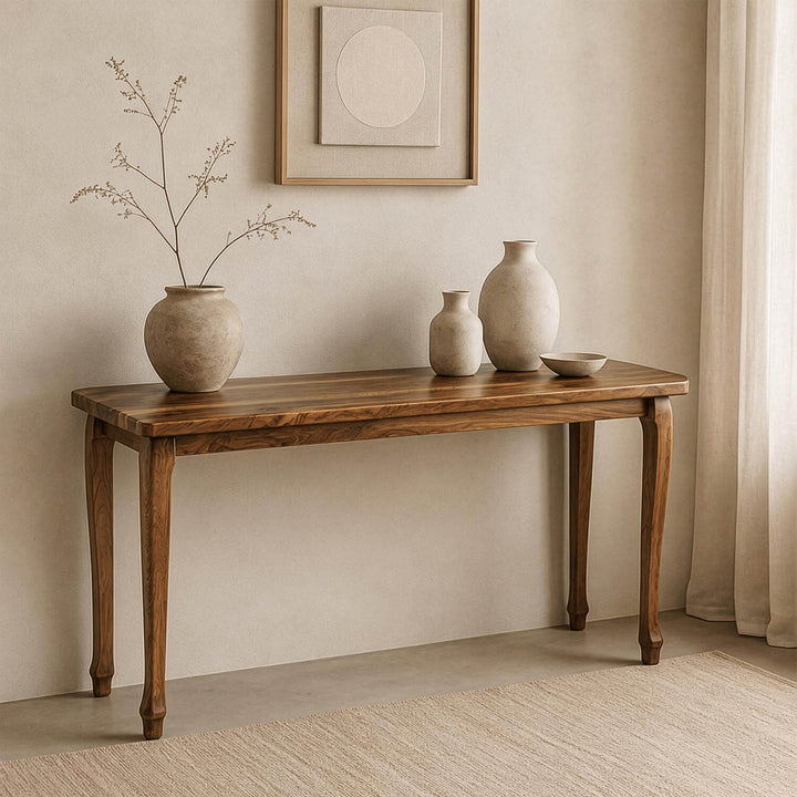 Artistic statement furniture piece: the cabriole legged walnut console table adding timeless warmth to a living space or entryway.