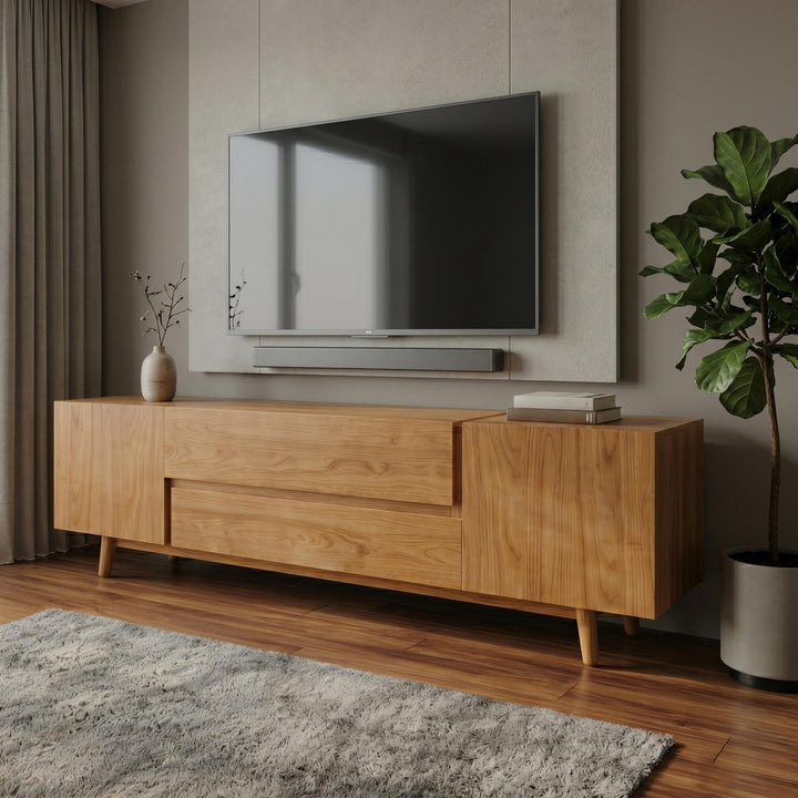 Wooden TV stand with a television mounted on a wall in a living room.
