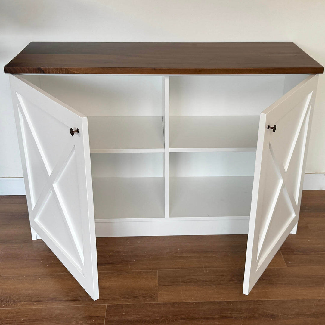 A sophisticated home staging setup highlighting the modular storage cabinets and open shelving configuration.
