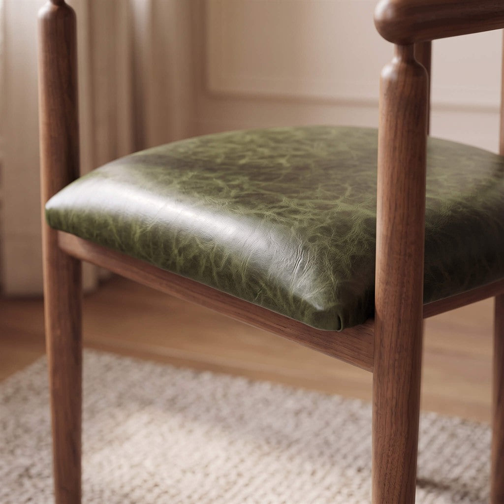 Modern dining room chair crafted from solid walnut wood with rounded spindles and upholstered seat   