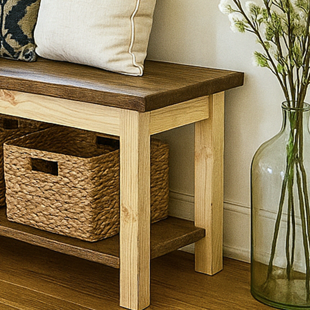 Wooden bench with storage basket and decorative vase on a wooden floor.