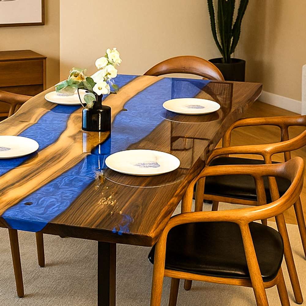 Dining table with blue resin runner and wooden chairs in a room setting.