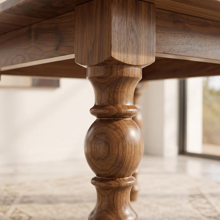 Turned solid wood leg of the Garnet oval dining table, shaped on the lathe