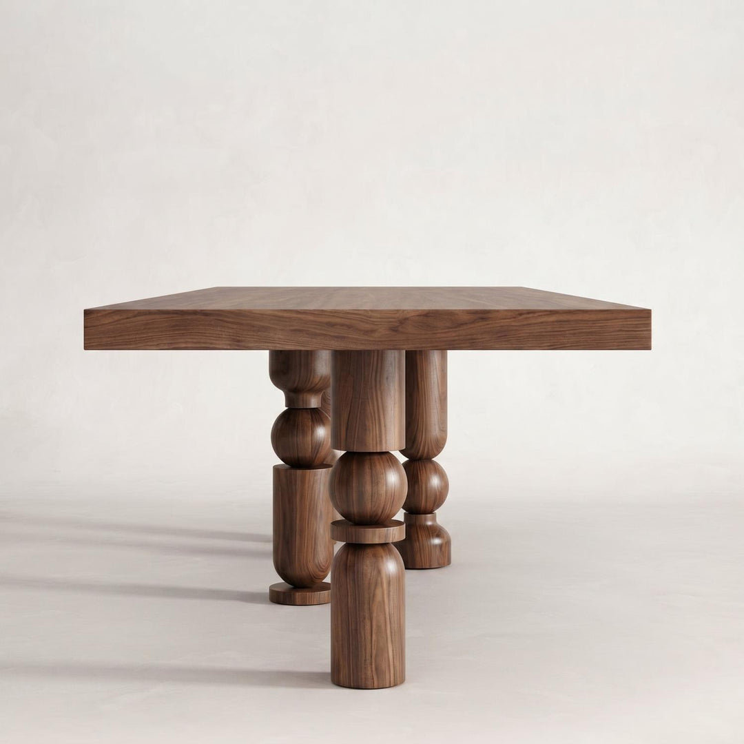 Postmodern Turned Wood Dining Table presented in a bright and spacious studio setting for interior design inspiration.