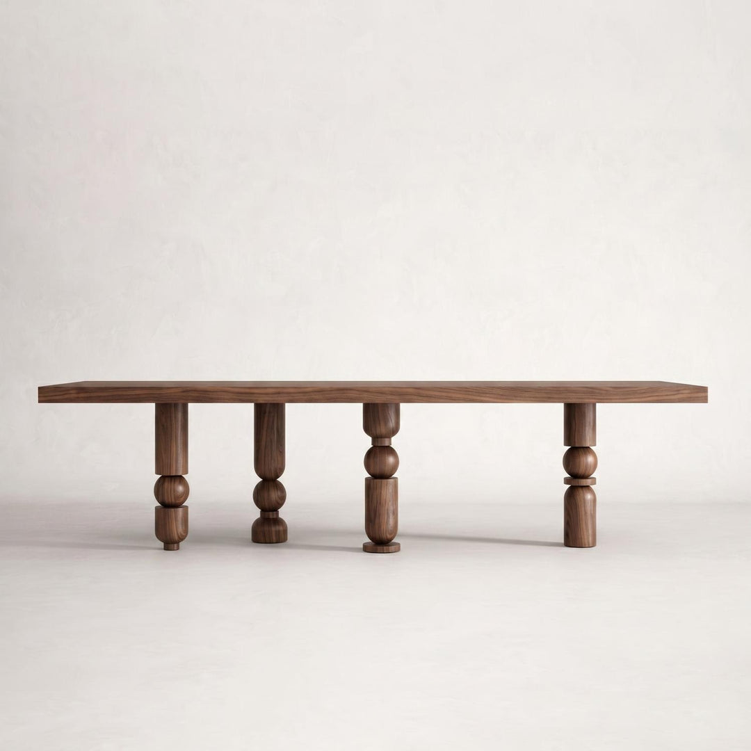Architectural statement piece featuring the Postmodern Torna Ayaklı Ahşap Yemek Masası with structural sphere and cylinder leg motifs.