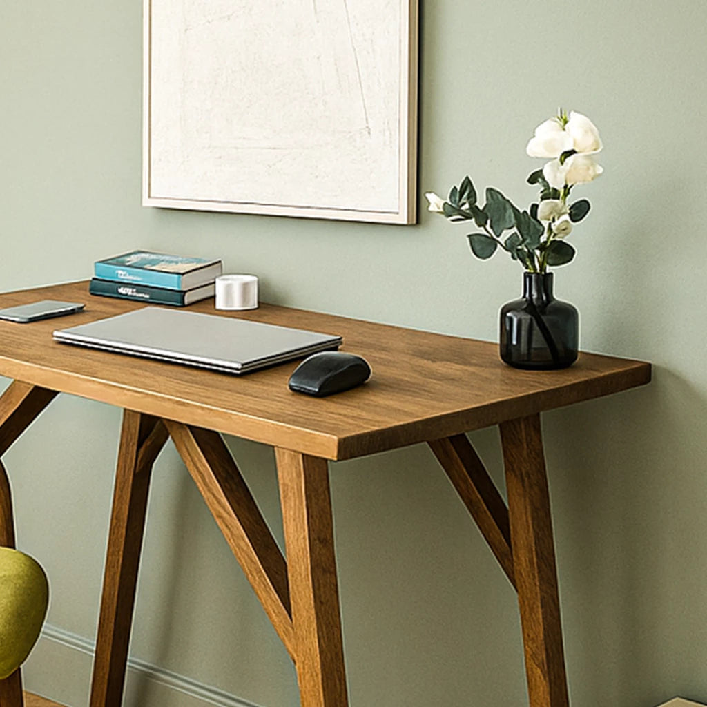 Handmade walnut desk with a laptop and chair, designed for small office spaces, showcasing solid wood craftsmanship.