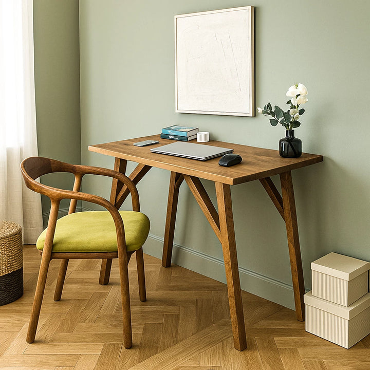 Handmade walnut desk with a chair and a green chair, ideal for small office spaces. Solid wood construction.