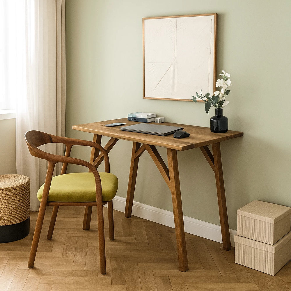 Handmade walnut desk with a chair, complemented by a painting on the wall, ideal for small office spaces.