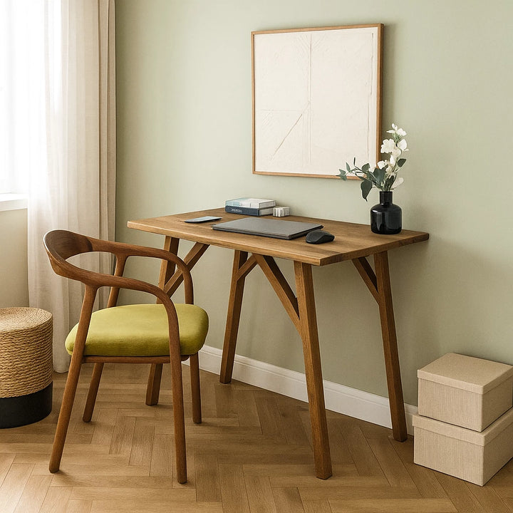 Handmade walnut desk with a chair, complemented by a painting on the wall, ideal for small office spaces.