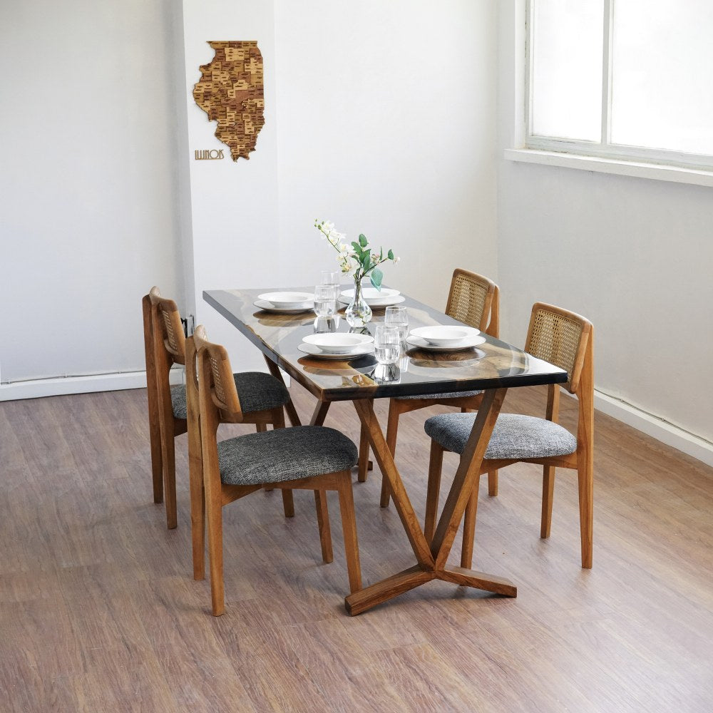 Black walnut epoxy dining table from the far left corner with the wooden Y shaped foot visible
