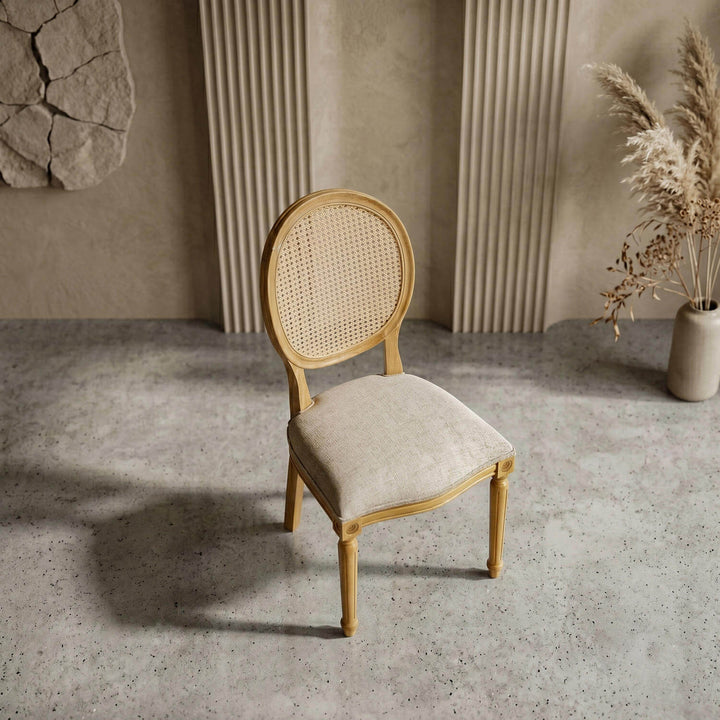 Sophisticated medallion beech chair blending a circular rattan mesh back with fine upholstery for luxury dining rooms.
