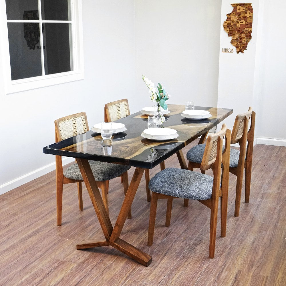 Obsidian live edge dining table from a high corner angle, set for four
