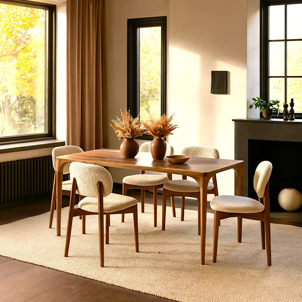 Oslo Solid Walnut Dining Table featuring a modern Scandinavian design with a sleek, curved wooden top.