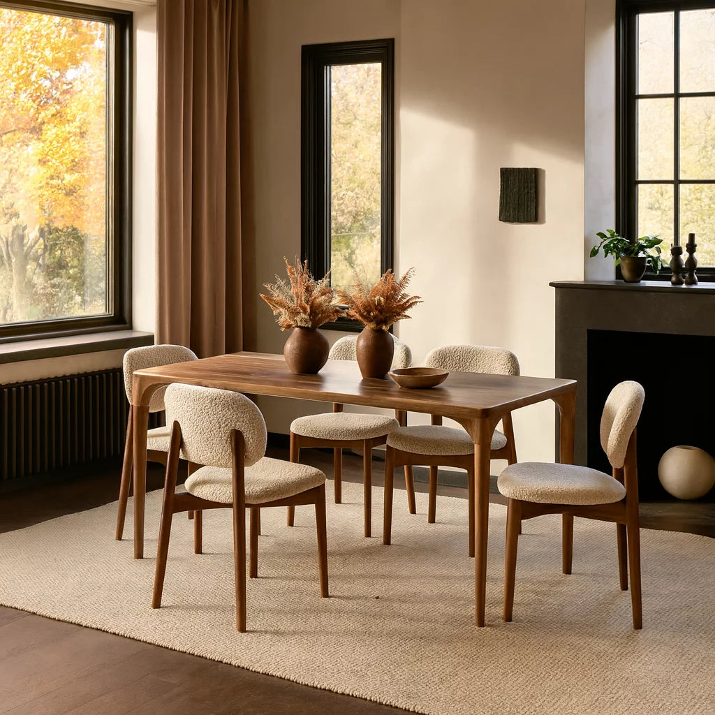 Oslo Solid Walnut Dining Table featuring a modern Scandinavian design with a sleek, curved wooden top.