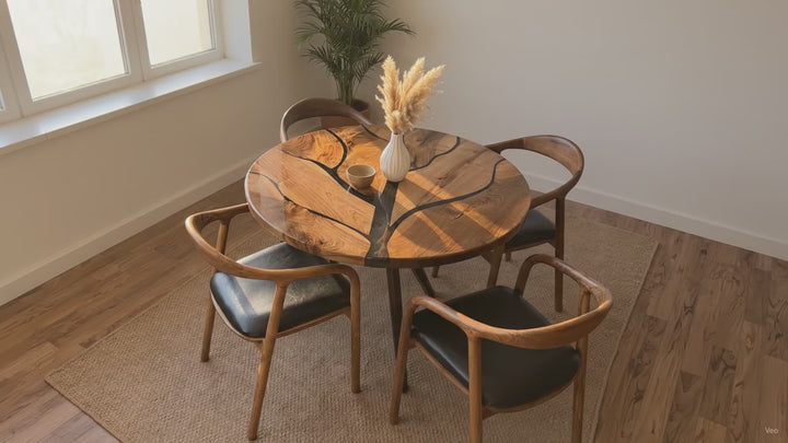 Tree pattern walnut table blending organic wood grains with branches of sleek epoxy resin to add an artistic statement to modern living spaces.