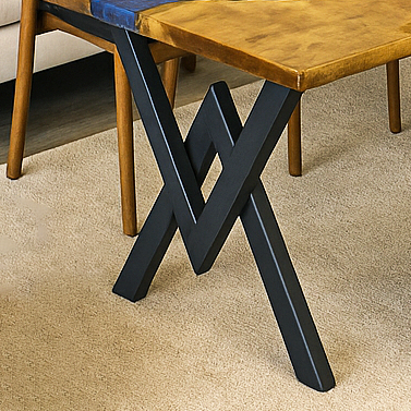 Artisan farmhouse dining room table combining blue epoxy with solid walnut