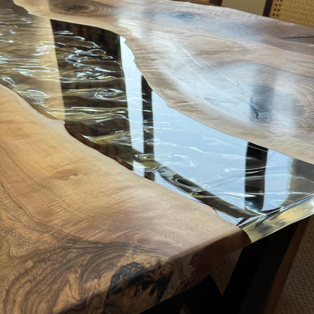 Silverrill dining table paired with woven back armchairs for contemporary interior decor
