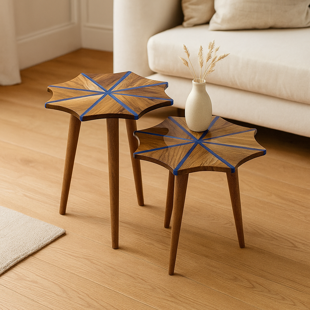 Two walnut nesting side tables with snowflake tops and blue epoxy stripes beside a sofa