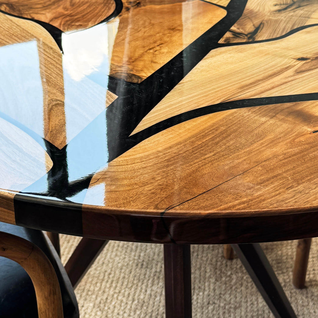 Tree pattern walnut table capturing rich natural wood grain structures, positioned elegantly on a woven indoor rug.