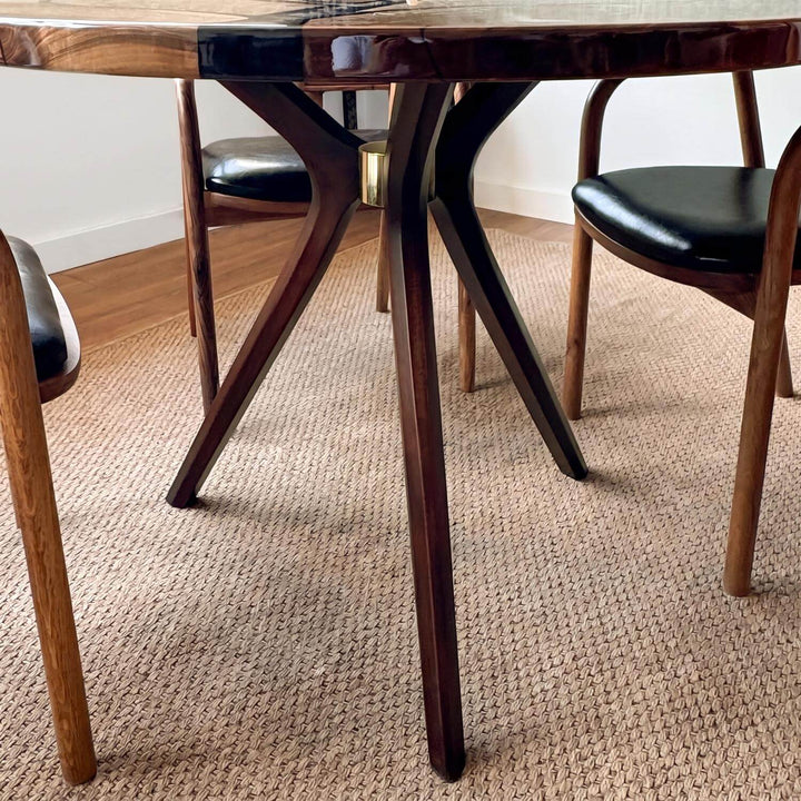 A timeless furniture piece blending rustic nature-inspired motifs with modern design: the durable tree pattern walnut table.