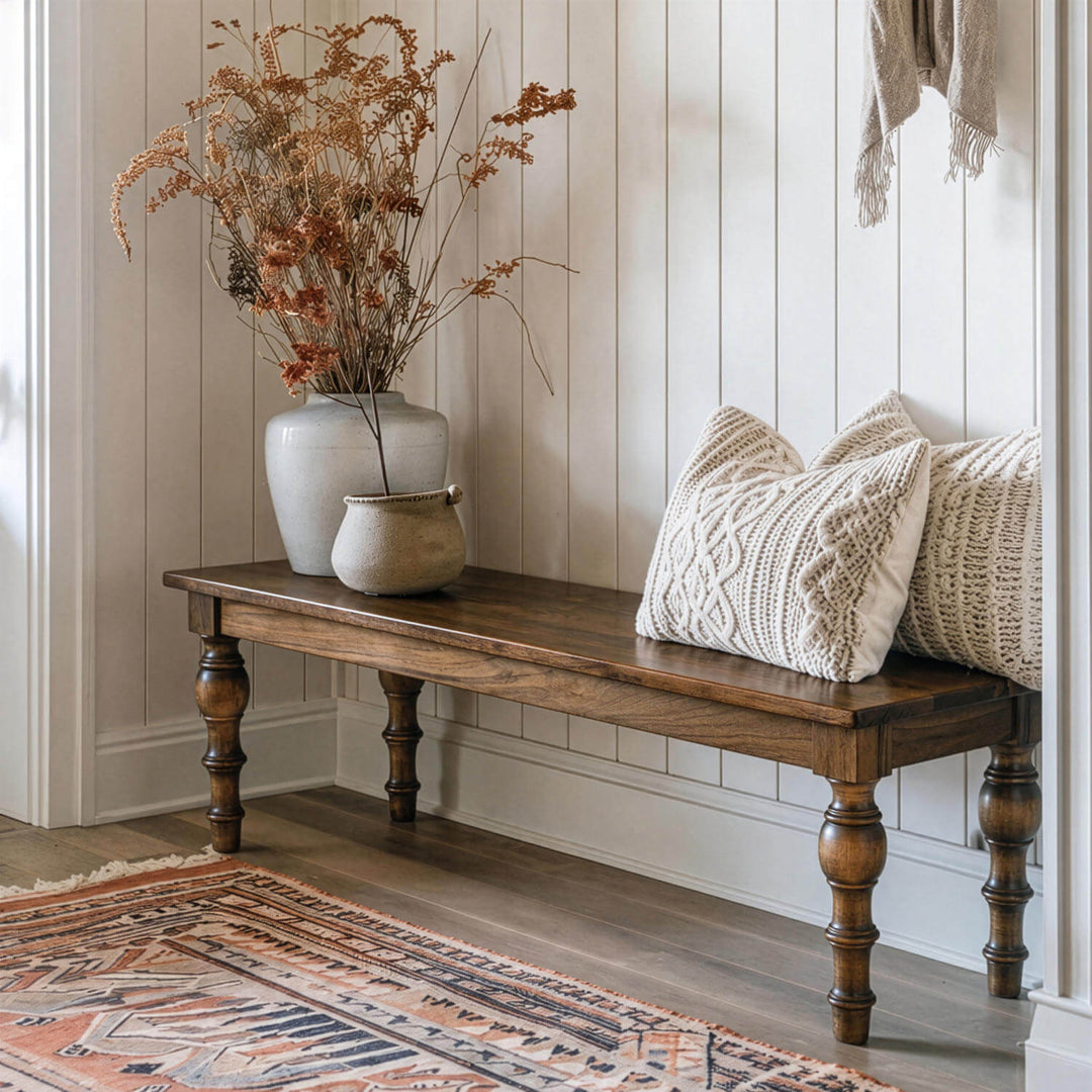 Traditional turned leg wooden bench blending rustic charm with architectural carved leg profiles.