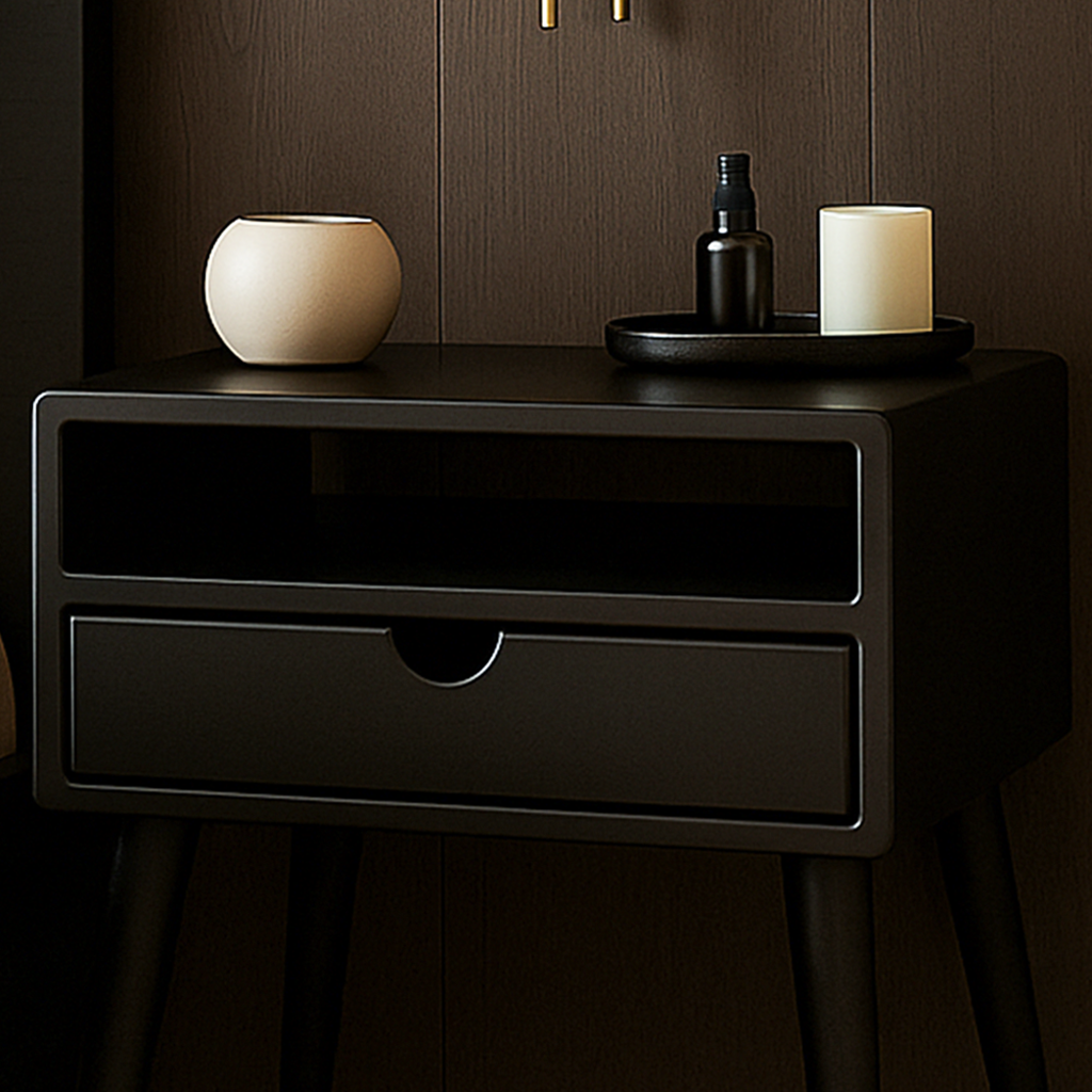 Black nightstand with a drawer, decorative items, and a dark background