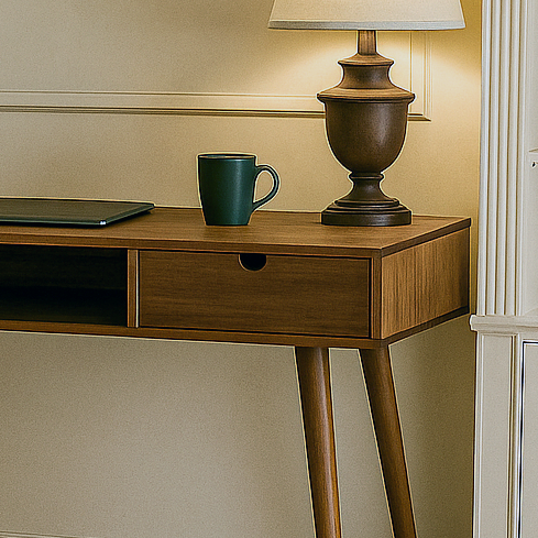Close-up of the walnut desk's drawer with a finger notch beside the open cubby, mug on top