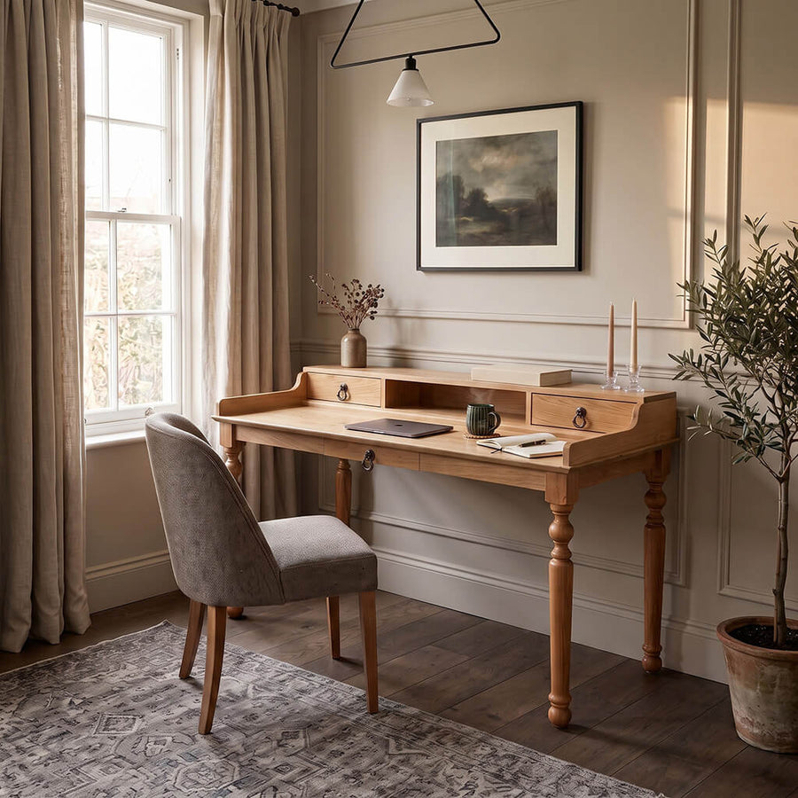 Victorian solid oak desk with a hutch and turned legs, with an upholstered chair in front of a window