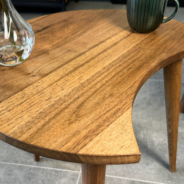 Close-up of the solid walnut C-shaped side table top grain and the curved cut-out