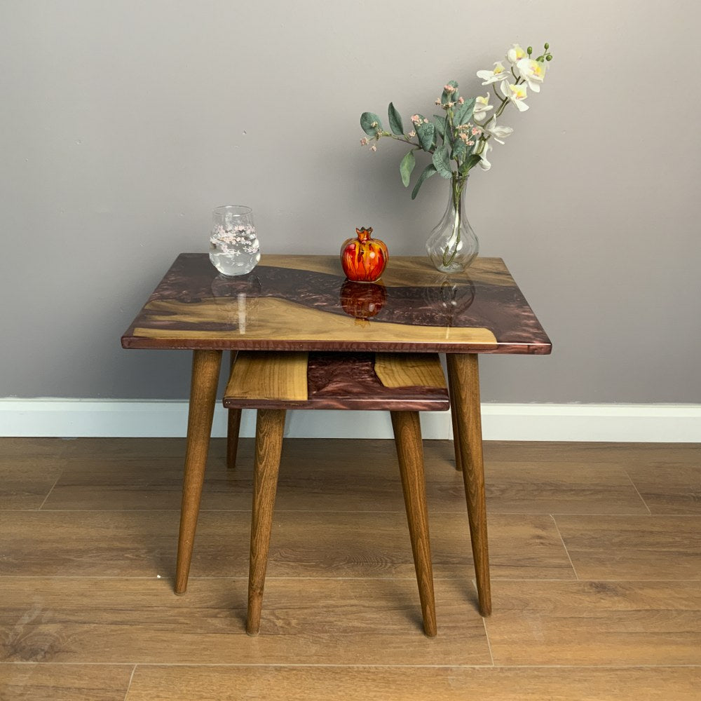 Straight-on view of the large walnut nesting table, with the small table hidden under it