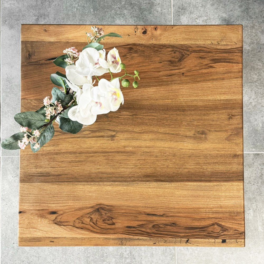 Top view of the square walnut wood top of the farmhouse side table
