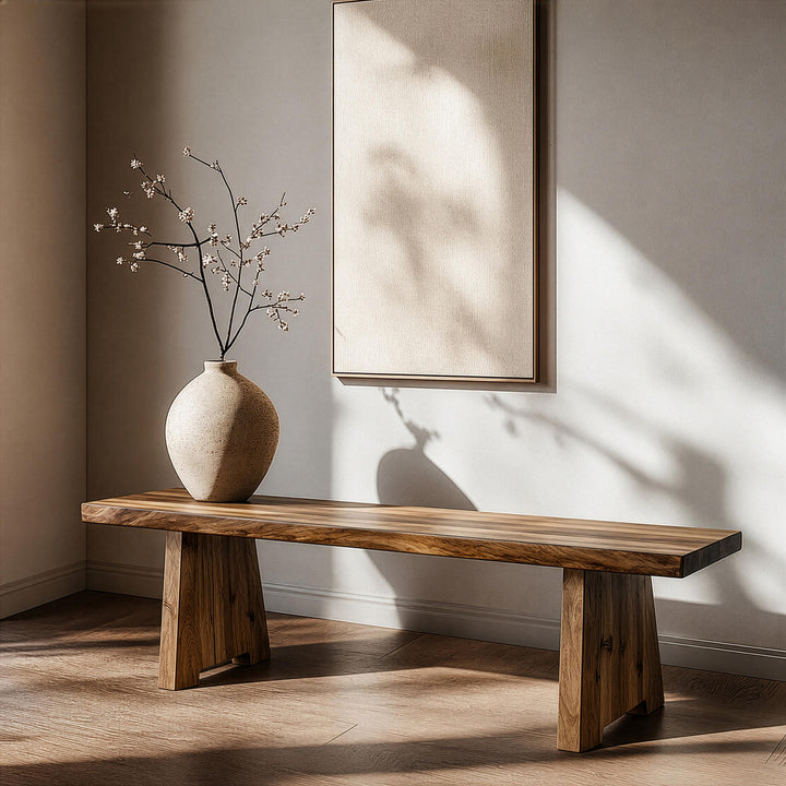 Modern walnut wood bench highlighting rich, organic wood grain patterns on its smooth top surface.