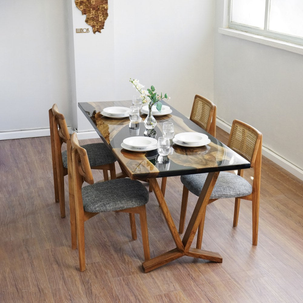Raven live edge table seen from the near right corner of the room with chairs along the side