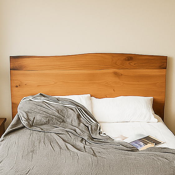 Bed with wooden headboard and gray blanket
