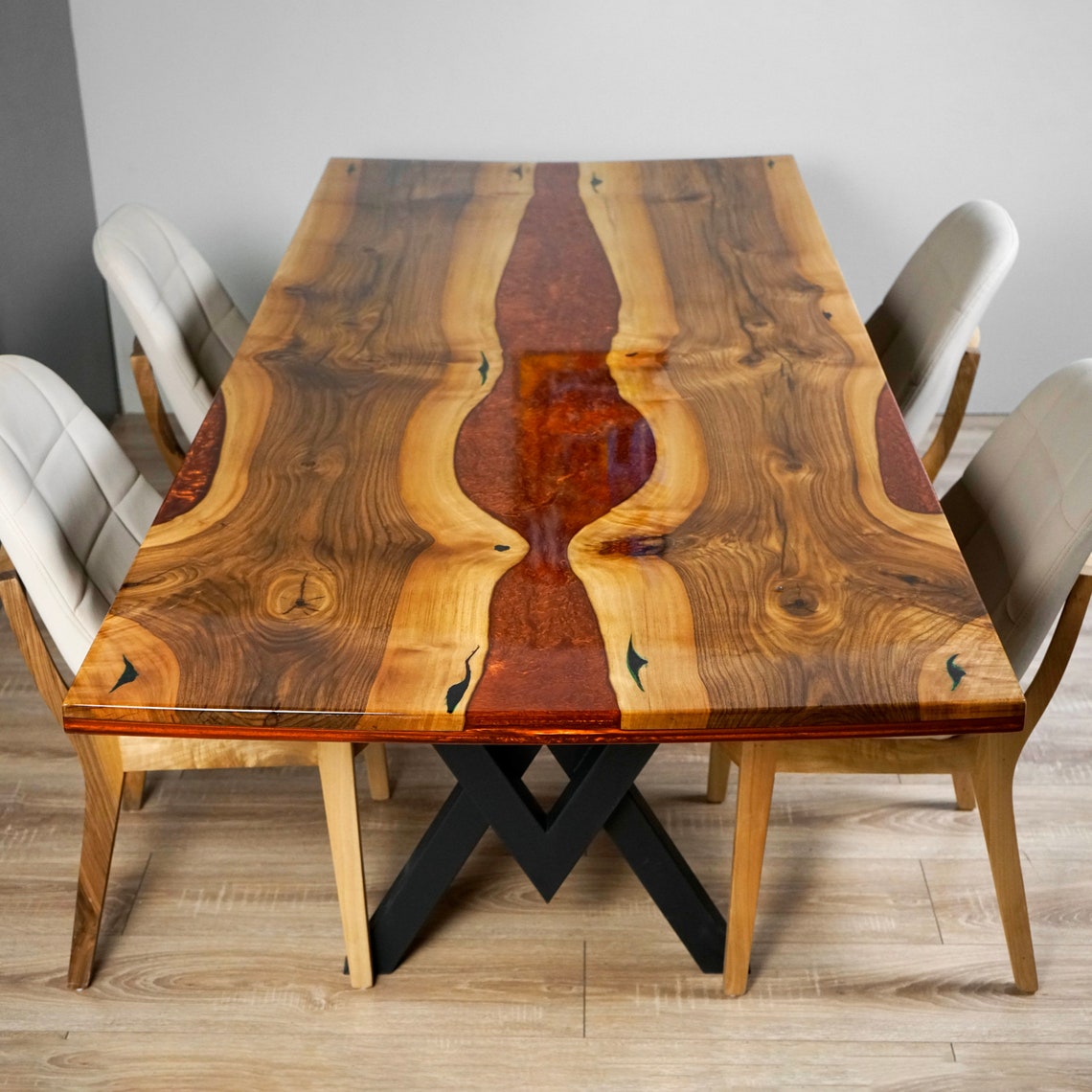 Top view of the Amber walnut dining table with the burgundy epoxy river running down the center