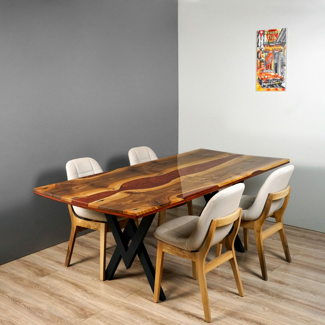 Burgundy epoxy river walnut dining table, three-quarter view from the end with four chairs