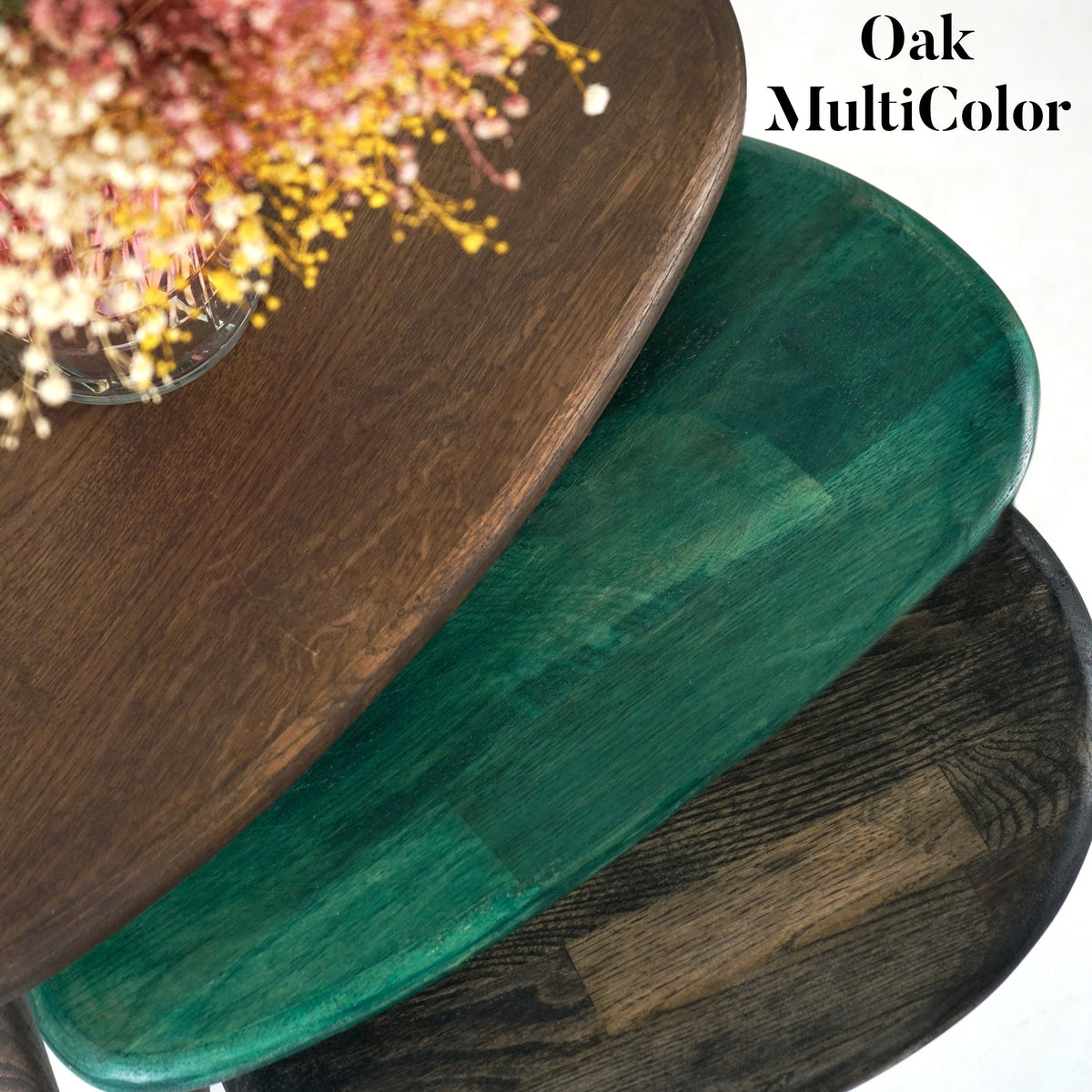 Close-up of multicolor oak nesting tables with chocolate, green and charcoal black tops, labeled Oak MultiColor