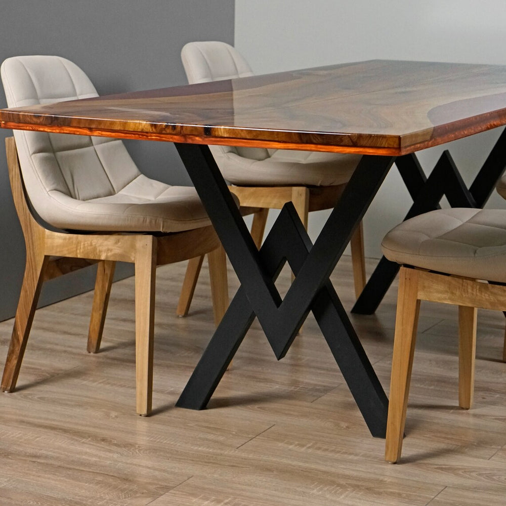 Black zigzag metal legs and burgundy epoxy edge of the live edge walnut kitchen table with chairs